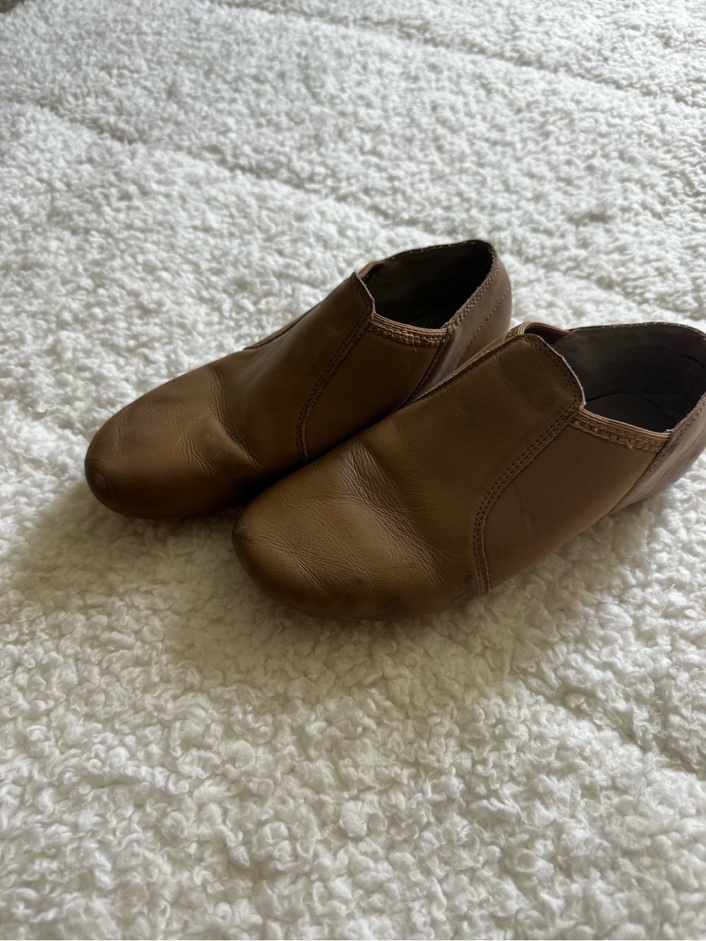 Tan slip-on jazz dance shoes